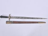 pair of old swords on a white surface with a wooden handle