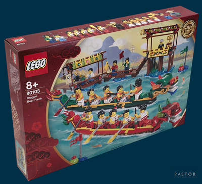une boîte de Lego avec une image représentant des personnes dans un bateau