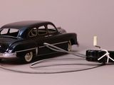 a toy car that is connected to a charger