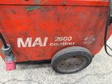 a red machine that is sitting on the ground