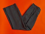 a pair of black pants on an orange background