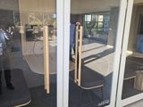 a reflection of a man in the glass of a building