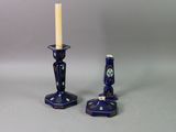 two candles that are sitting next to each other on a table