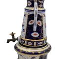 a blue and white coffee pot with a faucet on it