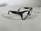a close up of a pair of glasses on a table