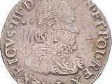 a close up of a coin on a white surface