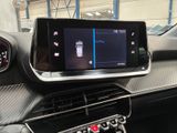the dashboard of a car with a digital display in the center of it