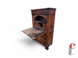 an old wooden desk with a drawer underneath it