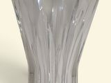 a glass vase that is sitting on a table