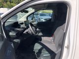 a white truck with the door open in a parking lot