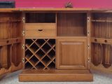 a wooden cabinet with a wine rack inside of it