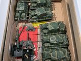 a box with a bunch of toy army vehicles inside of it