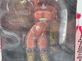 a toy figure of a woman in a leopard print outfit