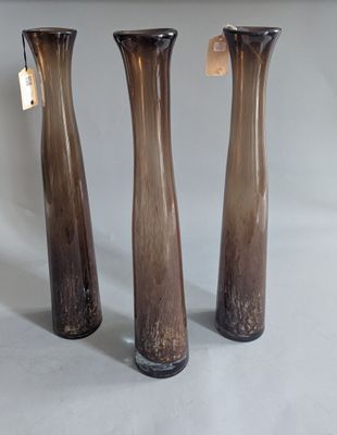 three vases that are sitting on a table