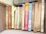 a box full of books that are sitting on the floor