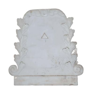 an image of a white marble plaque with a triangle on it