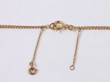 a close up of a gold chain with a clasp on it