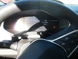 a close up of a steering wheel in a car