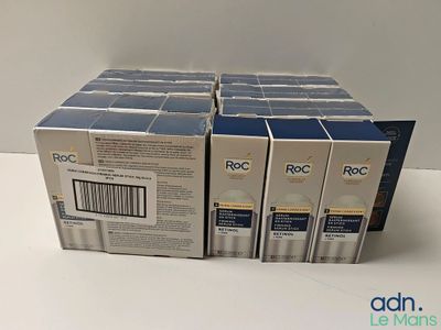 four boxes of roc cream sitting on top of a white table