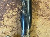 an image of a sword with a dog on it