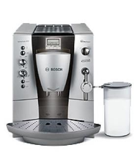 une image représentant une machine à café avec une tasse à côté