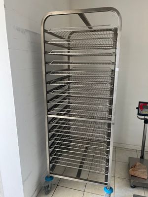 an image of a commercial food drying rack in a kitchen