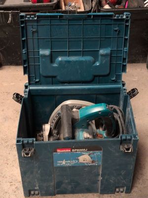 a blue tool box with tools in it on the floor
