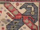 a close up of a rug with a bird on it