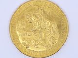 a gold coin with a picture of a man on a horse