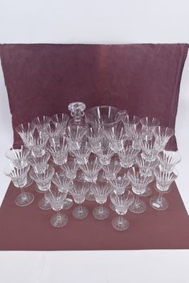 a lot of wine glasses sitting on a table