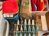 a lot of utensils that are on the kitchen counter