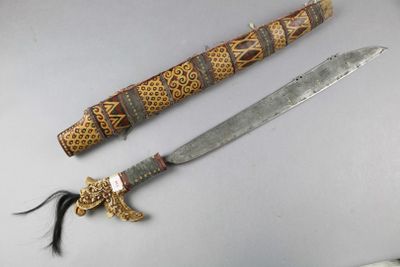 two different types of knives on display on a table