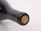 a close up of a bottle of wine on a table