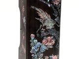 a black case with a bird and flowers design on it