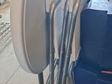 a lot of chairs that are stacked on top of each other