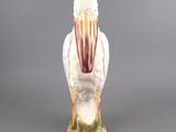 porcelain figurine of a white bird with a red beak