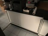 a picture of a kitchen counter with a printer on top of it
