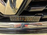 a close up of a car with a ruler on the front of it