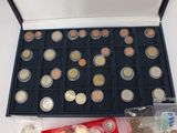 a lot of coins in a black box on the table