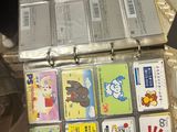 a suitcase full of children ' s books sitting on a table