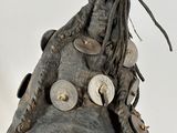 a very old shoe with a lot of buttons on it