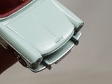 a small toy car that is being held by a person