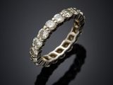 a close up of a silver ring on a black surface