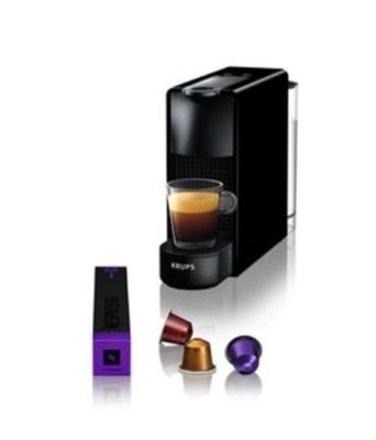 une machine à café noir avec une tasse violette à côté