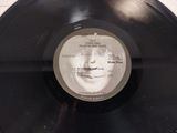 vinyl record with a picture of a man ' s face on it