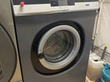 a washer and a dryer in a small room