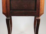 a side table with a marble top and wooden legs