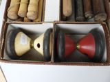 a box full of different types of wooden toys