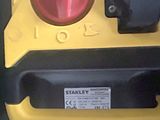a close up of a yellow and black fire hydrant
