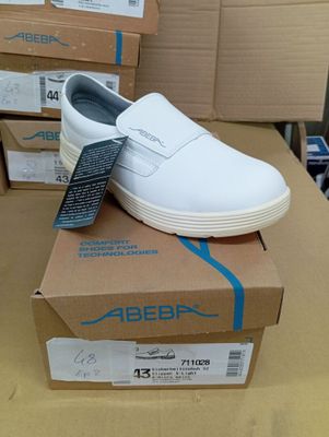 a pair of shoes that are on top of a box